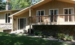 Wow! This recently remodeled home on half-acre+ lot will remind you of a vacation chalet with its sweeping views nestled in the trees. With its huge wrap-around deck, you can enjoy the scenery both inside and out. The large open great room with wood