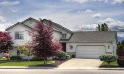 This gorgeous Spokane Valley home has the feel of a luxurious downtown condo with its elegant touches and designer colors. Master
suite has granite counters and a beautiful tile walk-in shower. Basement family room is designed for home theatre with built