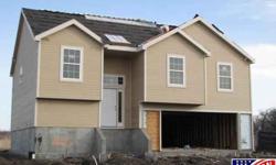 LIVING ROOM AND MASTER BATH CEILING ARE VAULTED AND COFFERED. KITCHEN HAS A DINING AREA AND LEASE INTO THE LIVING ROOM. MASTER BATH AS DOUBLE VANITY, JET TUB, AND SHOWER. GARAGE IS A THREE CAR (ONE BEING A TANDEUM). EARLY IN CONSTRUCTION BUYER MAY CHOOSE