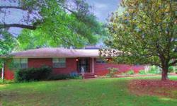 All brick home with original midcentury charm on 1.6 acres in convenient Hixon area. Hardwood floors throughout. 2 fireplaces with brick seating hearths in living room and breakfast room. Side entry leads to sunroom. Formal Dining room. Finished half