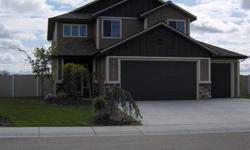 With high quality hardwood flooring at the entry, kitchen and dining areas and a Gourmet Kitchen that features slab granite countertops and alder cabinets you can't go wrong on this better than new home where you have completed landscaping and you can see
