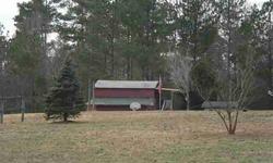 6 ACRES WITH 3 STALL HORSE BARN, DET WORKSHOP, STORAGE AND DOUBLEWIDE (NO PERMANENT FOUNDATION). BEAUTIFUL LAND. LA MUST ACCOMPANY ALL SHOWINGS. DOUBLEWIDE IS LEASED MONTH TO MONTH. GOOD TENANTS. NEAR TRIANGLE TOWN CENTER, 540. COUNTRY LIVING WITH CITY