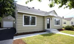 WOW - Fully remodeled 4 bedroom home in downtown Puyallup is ready to go! Features include a light & bright open floor plan w/2 bedrooms up, and 2 down, a spacious living room with dark stained original hardwood floors & gleaming white painted millwork
