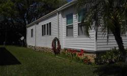 Nice home, furnished with all appliances. Refrigerator and glass top stove only 1 year old. Stack washer/dryer is 2 years old. We have replacement windows that are 4 years old. All windows have vertical blinds. There is an enclosed Florida room. All rooms