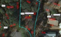 Beautiful lot in Woodlake Country Club a golf community with club house, pool and lake. Lot is located on a cul-de-sac and has a golf view. Membership included, Buyer to pay transfer fee. POA dues are $0.31 per $100 of assessed tax value.Listing