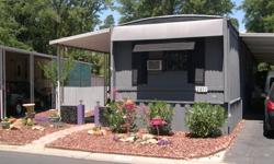 Cute as a Button & Ready to Move Into! Welcome Home to Hidden Springs Villa an Adult 55+ Mobile Home Community in a Beautiful Park Like Setting. This 2 Bedroom, 2 Bath Home has been Updated Through Out Top to Bottom. It sits on a Larger More Private Lot