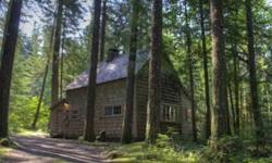 This 1929 original cabin sits in the Cascade foothills right on the bank of the Zig Zag River. Tall soaring knotty pine ceilings make for a fantastic gathering place for family and friends. Bring the whole ski team and sit in front of the floor to ceiling