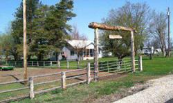 This charming country home offers country living at its best. Just 6 miles from town it is perfect for horses, 4-H animals, with barn, new pole fencing, sub-irrigated pasture. The house has potential for 5 bedrooms or 4 bedrooms and an upstairs family or