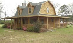 Log Cabin home with wrap around porch on 2.278 acres. 2 beds 2 1/two bathrooms home with Granite in kitchen, wood flooring, a true log cabin home.Debbie Pacas is showing this 2 bedrooms / 2.5 bathroom property in Pine Grove. Call (225) 768-1800 to arrange
