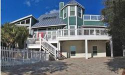 RENTAL INCOME IS CONSISTENTLY OVER $100,000 PER YEAR. Pelican Beach offers 7 bedrooms and 6 baths with a large dining room and breakfast area. 3 decks and 2 porches. Open modern kitchen for those family gathering dinners. Pelican Beach is located just 35
