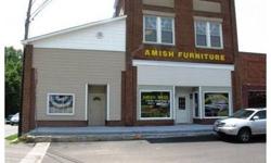 This commercial property consists of 2 buildings. One is currently being used as the Amish Furniture Store and the other is used for storage. New roof in 2005, new heating system and windows. Enclosed loading doc will accommodate a tractor trailer. Both