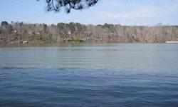 Borders two roads. Plenty of room to build two or more cabins or put a camper. The water front is gentle slopping. Wide area of Brush Creek. This lot has been pre-approved for a 2-slip boat dock w/swim dock and 60 ft. walkway. Paved roads, located min.