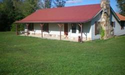 Beautiful country home with rocking chair front porch.Well-built home with 2X6 exterior walls providing more insulation and lower utility bills, new tin roof too. Beautiful stone wood burning fireplace. 45X50 barn on property with creek and 2 ponds