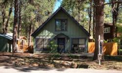 AN AMAZING MOUNTAINAIRE CABIN WITH FOREST SERVICE ACCESS JUST DOWN THE STREET! The downstairs features hardwood floors, 2 gas stoves, great room, den, bedroom plus an updated and remodeled kitchen and bathroom. Upstairs is a very spacious loft bedroom.