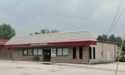 With a great deal of visibility on a corner lot,just below The Putnam County Justice Center. This commercially zoned property can be utilized for many ventures. Tenant in building is on month to month lease. $2000.00 per month. Living quarters at rear of