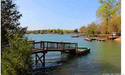 Beautiful water front lot, buy now and build your dream home later! Lot does have floating dock in place. Take advantage of this exceptional price on a wonderful lake front lot! Adjacent home also for sale, see mls#