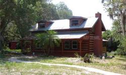 Bring the Horses and all the pets for this Great Family, Two Story, 4 Bd, 2 Bath, 1800 sq.ft, Log Home, All on 5 Acres. Newer large metal workshop and horse stables. Perfect site and with a close-in location just North of Palmetto.Home being sold AS-IS,