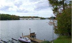 DIRECT FRONTAGE on Clam Lake w/private boat slip & in 3 minutes you're sailing into the sunset on Torch Lake!This is the largest unit in complex-almost a triple unit, has huge private balcony(can be enclosed/added in) o/looking the lake, nice common
