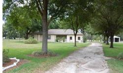Wonderful block home on 3.9 acres with 2 huge detached buildings. Home offers a nice large floor plan with over 2500 sq ft, parking for 3 cars, large screened porch in back and large covered porch in front. Detached buildings have electrical and lighting