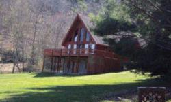Come and getaway in this Beautiful A-Frame chalet. This home offers great views with large decks to enjoy the mountain senery and sits in a park like setting. The 5.33 acres is very usuable with great areas to garden. This home offers large windows which