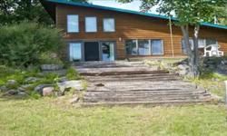 Gorgeous home with 148' of frontage on Big Lake. Home features 2 bedrooms, 2 baths, sauna, wood fireplace, patio, dock & 4 car garage space.
Listing originally posted at http
