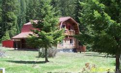 Beautiful 2 bdrm 2 bath log home on 5.64 acres, very private. Home has a large deck off the back and all appliances stay! Property has an addt'l log structure that can be used for an office, art studio or guest house, 3 large sheds and a 24X35 detached