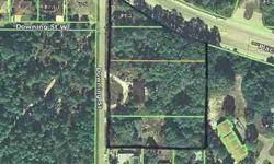 Nearly 3 acres of land with two homes on this private wooded setting has many possibilities. Home #1 is a 3bd/2bd/2cg charming home. Offers plenty of privacy with wooded views and yet coveniently located close to restaurants, shops, banks, beachesand