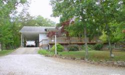 Country charmer graciously adorned by 7 acres of beautiful mature landscaping. If you enjoy privacy this is the perfect home for you. Home includes 30X50 fully insulated and heated RV garage and 30X40 Storage Barn. Located 1 mile to Bull Shoals Lake &