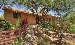 Cute cottage get-away! Nice open views of red rocks to north and Mesa to south. Very comfortable home, feels bigger than it is, easy to maintain. Recent appliances, floors, paint and gas pack. Close to conveniences! Fully fenced yard with great gardens