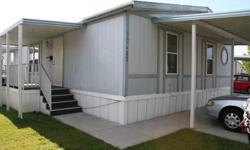 Three bedroom double wide, excellent condition, nice carpet, built in china hutch, cathedrial ceilings, new pull out windows throughout, roof re-shingled 2003, new water heater installed 2010, located in Riverside Mobile Home Park with $530.00/mth rent.