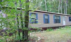 1990 mobile home with 2 bedrooms, 1 bath, well & septic new in 2002 and metal roof new in 2009. Lot backs up to Common Area and Beaver Pond. Lakes of the North has Clubhouses,Pool,2Lakes,Golf Course,Restaurant,Airport,Winter Sports Center,DNR Snow Tr,LN
