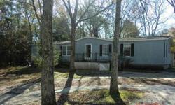 Spacious double-wide with Kitchen open to Great Room with fireplace. Located on 2.52 acres in Columbia County. Sold AS IS