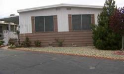 Country, cozy, roomy, convenient,low maintenance, easy living, are all just a few adjectives to describe this mobile home in a senior park. This Mobile home has been upgraded with front and back doors,kitchen,flooring, and appliances.There are 2 storage