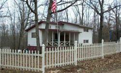 Cute curb appeal but need TLC. Wood burning fireplace. Has much potential. Sits on double lot with lake view. Walking distance to lake. Built in 1970. Septic need some work. Property sold as is, seller to do no repairs or inspections.
Listing originally