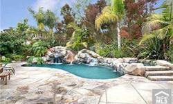 Welcome to your own Private Paradise! Great for outdoor entertaining, enjoy a Sparkling Pool with Rock Surround complete with Water Slide, Cave, Waterfall, & Spa! Built-In BBQ + Fireplace + Fountain with Lush, Tropical Surrounds! This fabulous estate