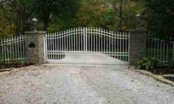 LOVELY FRENCH COUNTRY ESTATE.ENTER THROUGH WHITE IRON ELECTRONIC GATE. FOLLOW A WINDING CONCRETE DRIVE WHILE ENJOYING A SERENE PRISTINE COUNTRY SIDE OF TREES AND LANDSCAPING. COURT YARD ENTRANCE TO MAIN HOME. THE SELLERS LIVED IN THE CARRIAGE HOUSE, BUILT