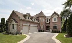 From the moment you see this beautiful newly constructed custom home it?s easy to see how it stands out from the rest! A stately paver-lined driveway leads up to this impressive residence with attractive turret, dormered windows and an all brick and stone