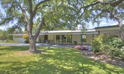 Large Family home on 2 acres surrounded by golf course. Designed by famed architect Wyatt Hedrick, protege of Frank Lloyd Wright, who designed another home on this same street.Listing originally posted at http