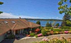 Perfectly positioned for the Best in Life! Awake daily to dramatic views sweeping across the Tacoma Narrows to Mt. Rainier as boats, trains & tides pass in the distance. This exquisite custom home complements its ?destination address? of One Point
