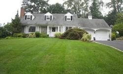 PRIDE OF OWNERSHIP IS EVIDENT THROUGHOUT THIS STATELY COLONIAL LOCATED IN THE OLD COUNTRY CLUB SECTION OF RIDGEWOOD. SITUATED ON ALMOST A HALF ACRE OF BEAUTIFULLY MANICURED GROUNDS, THIS CUSTOM BUILT PETERSEN COLONIAL HAS BEEN LOVINGLY MAINTAINED AND