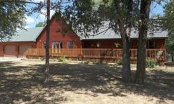 Beautiful 3 bedroom 2 bathroom home build in 2001 on 400 acres. All hardwood, from the floors to the cathedral ceiling. This home has a nice large kitchen, dinning area with french doors that lead to the back deck, an office, large living room, cedar