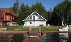 Great location on southwest shore of Payette Lake at the end of secluded lane. Features 60' of waterfront/sandy beach and private boat dock.Listing originally posted at http