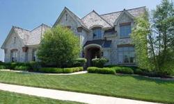 This lakefront home built by Havlicek shows like NEW! 6500 sq. ft. on 3 Levels. Elaborate millwork & built-ins throughout