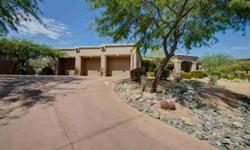 Wow, absolutely stunning home on 1 and 1/3 acre preserve lot in gated community. Walk through private courtyard and through double arched doors into an inviting foyer. Large living room with a wall of windows and mountain view will greet you upon entry.