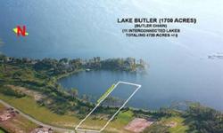 ASTONISHING VIEWS ON LAKE BUTLER Situated in a private cove along the western shore of Lake Butler this very rare 2.73 total acres (with 1.13 acres above the normal high water line) vacant building lot with NE/SW exposures features expansive views across