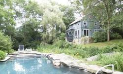 WebID 50070 If you love the "Water Lilies" paintings of Claude Monet, you will be enchanted by this 1.2 acre property. Not only is there a 60X400 pond with water lilies, irises, and cattails, but a wonderful foot bridge arching from the yard to an island