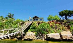 ....This is one of Possum Kingdom Lake's finest water front luxury homes... so if you can afford this price point then look no further because your search for a deep water lake location is over now. Prime location directly across from "Sandy Beach&qu
