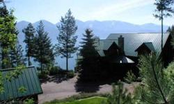 Stunning, big views into Skidoo Bay & Mission Mountain Range from waterfront lodge on Flathead Lake's Finley Point w 262' frontage. Furnishings, boats incl make it easy to jump right into this lovely home. Log accent, huge windows, theater room & wine