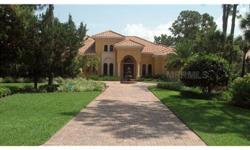 As you enter your extended brick paver driveway graced by a picturesque fountain, you feel like you're driving up to your Mediterranean home. A beautiful custom creation, built by John Cannon in 2008, features the latest hurricane protection including