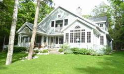 Historic Leland Village is the location for this treasure. Sited on Leland Golf Course & fronting the 16th hole with views of 4 fairways and 2 greens. Add to this deeded waterfront on coveted North Lake Leelanau with boat dockage just a short path away. A